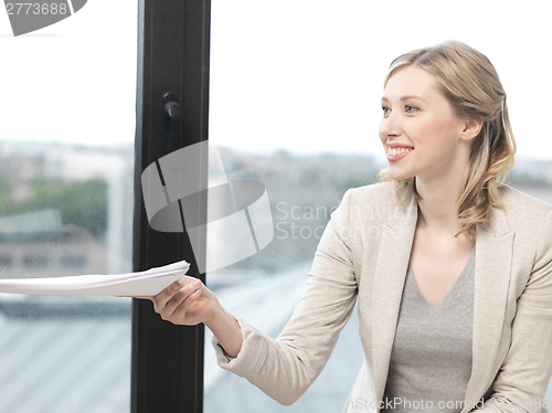 Image of happy woman with documents