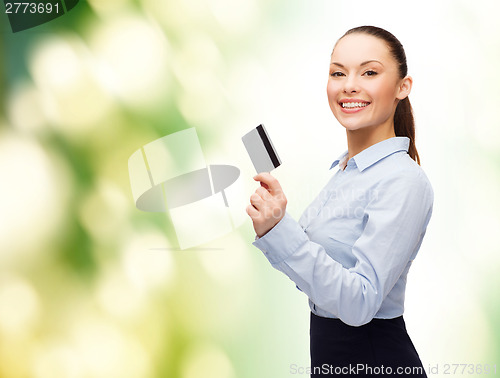 Image of smiling businesswoman showing credit card