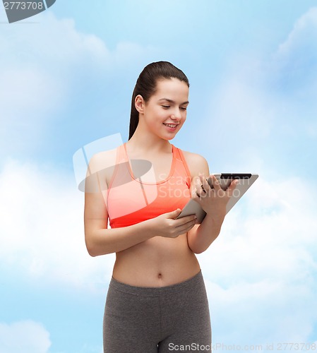 Image of sporty woman with tablet pc computer