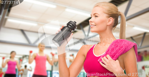 Image of sporty woman with special sportsman bottle