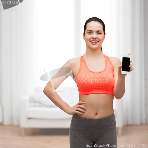 Image of sporty woman with smartphone