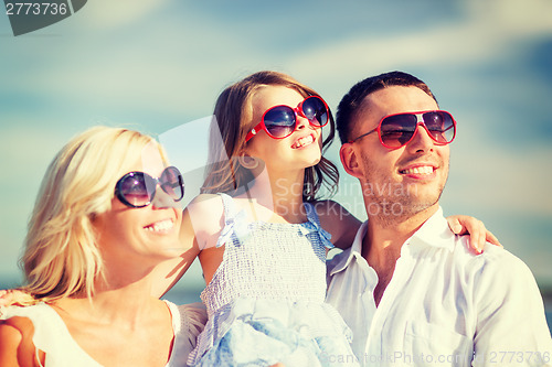 Image of happy family with blue sky