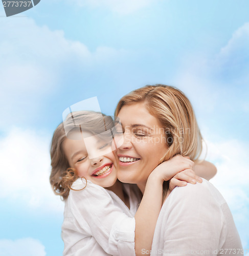 Image of happy mother and daughter hugging