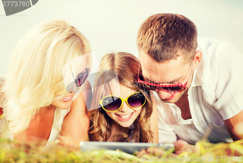 Image of happy family with tablet pc taking picture