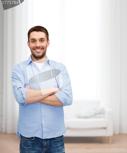 Image of smiling man with crossed arms