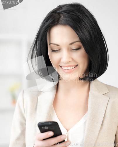 Image of businesswoman with cell phone