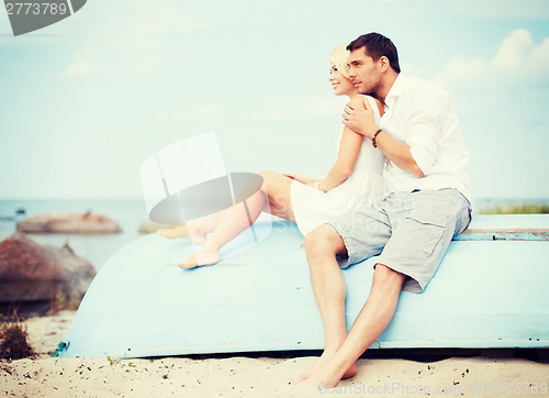 Image of couple in shades at sea side