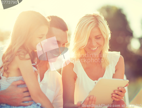 Image of happy family with tablet pc taking picture