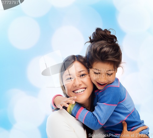 Image of hugging mother and daughter