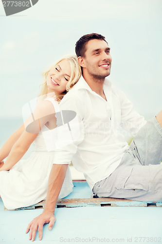 Image of couple in shades at sea side