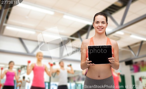 Image of sporty woman with tablet pc blank screen