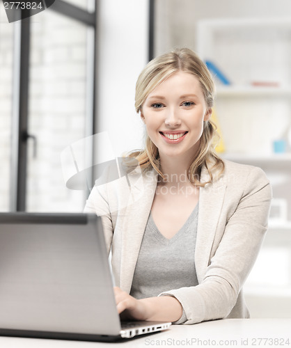 Image of happy woman with laptop computer