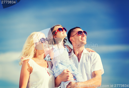 Image of happy family with blue sky