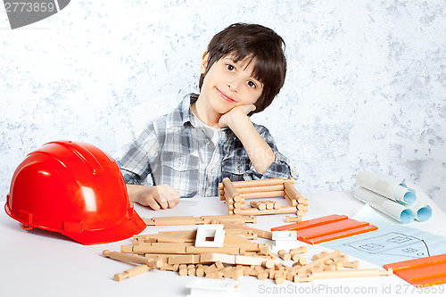 Image of boy plans to build a house