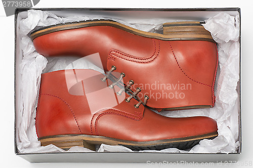 Image of new red shoes in box