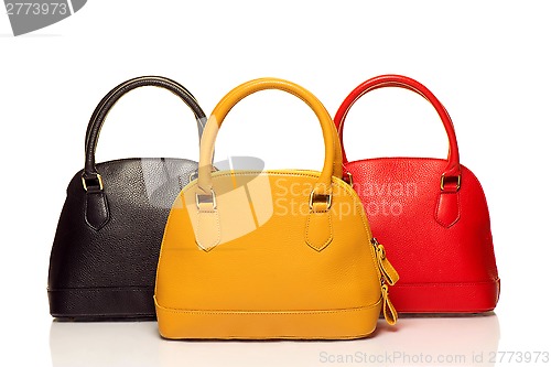 Image of three purses on white background