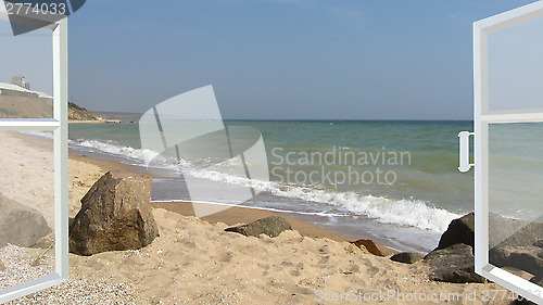 Image of opened window to the sea