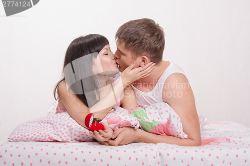 Image of Girl kisses guy who presented an engagement ring