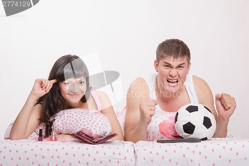 Image of Husband, according to his wife crazy with football