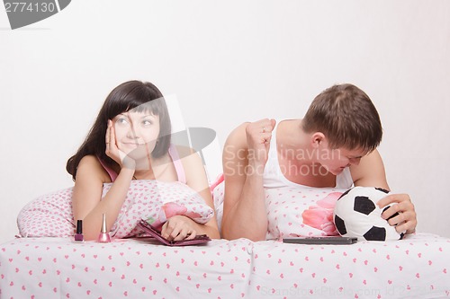 Image of Husband not upset by goal scored, wife was tired football