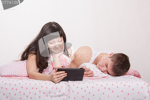 Image of Husband fell asleep while watching movie with his wife