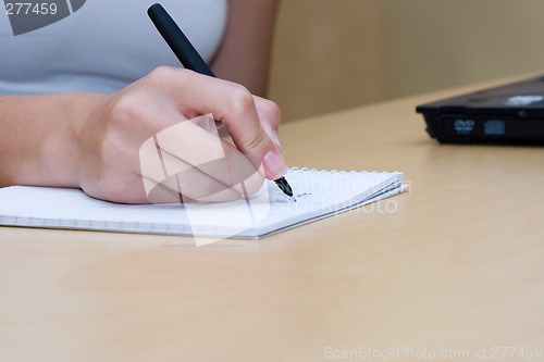 Image of woman writing