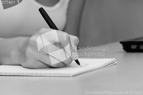 Image of woman writing