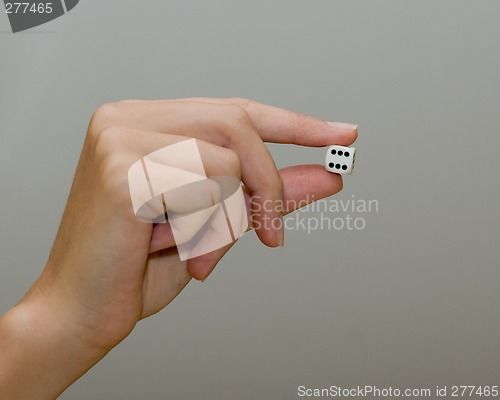 Image of woman holding dice