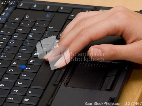 Image of Woman typing on a laptop