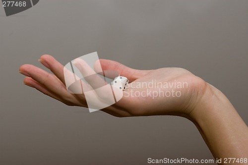 Image of woman holding dice