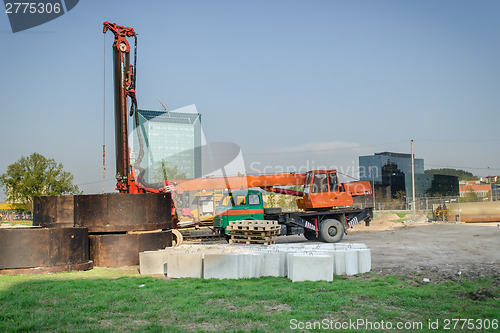 Image of construction site machinery crane cement blocks 