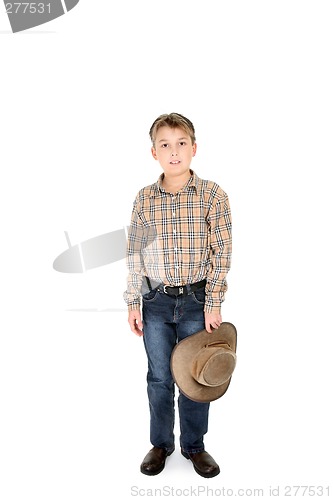 Image of Country boy holding hat