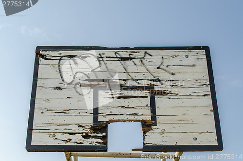 Image of wooden broken basketball board blue sky background 
