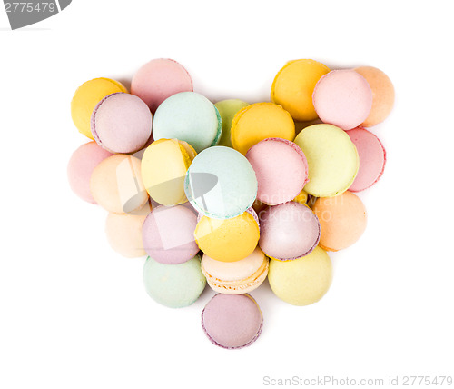 Image of Pastel color macaroons laid out in form of heart