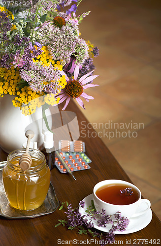 Image of Still life from medicinal herbs, honey, herbal tea and medicines