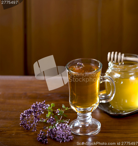 Image of Still life from medicinal herbs, honey, herbal tea