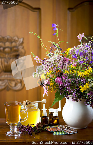 Image of Still life from medicinal herbs, honey, herbal tea and medicines