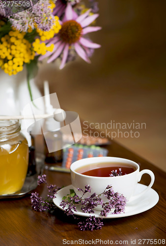 Image of Still life from medicinal herbs, honey, herbal tea and medicines