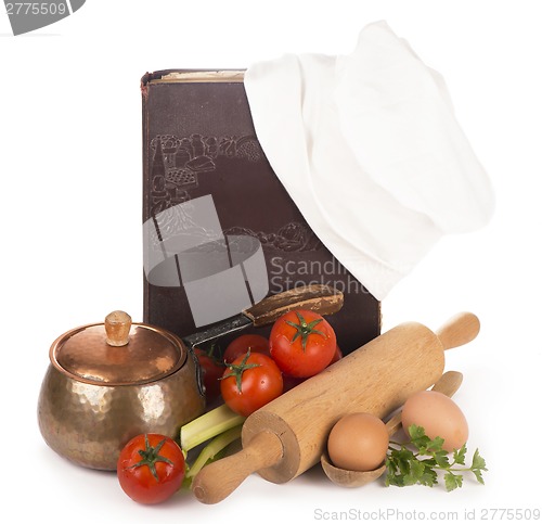 Image of Chef's hat with battledore and cook book
