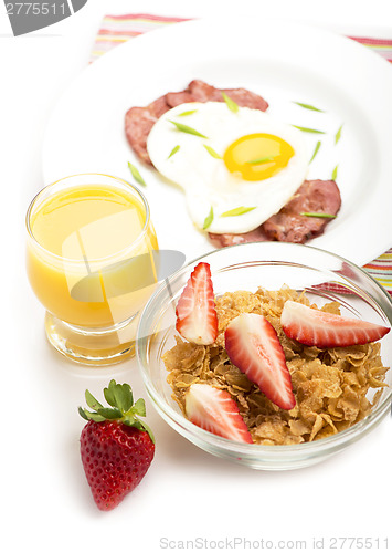 Image of Breakfast with bacon, fried egg and orange juice