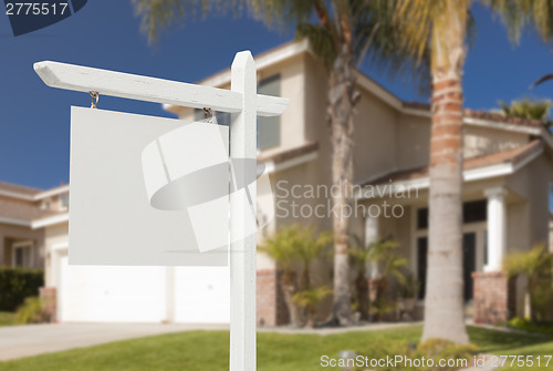 Image of Blank Real Estate Sign in Front of New House 