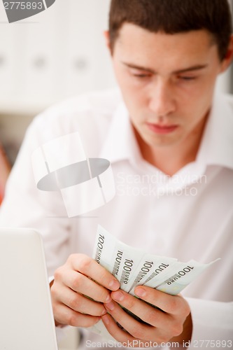 Image of businessman with cash