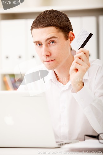 Image of man holding credit card