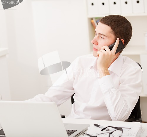 Image of man working and using laptop