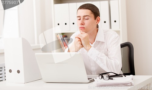 Image of man working on laptop