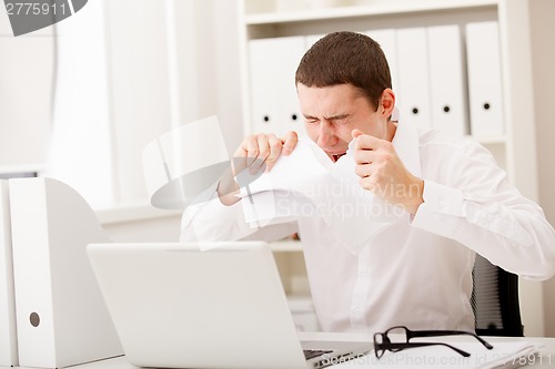 Image of angry man with document