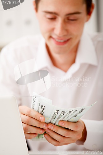 Image of businessman with cash