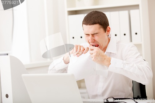 Image of angry man with document