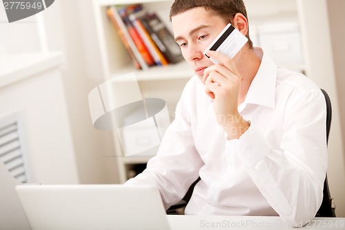 Image of man with credit card