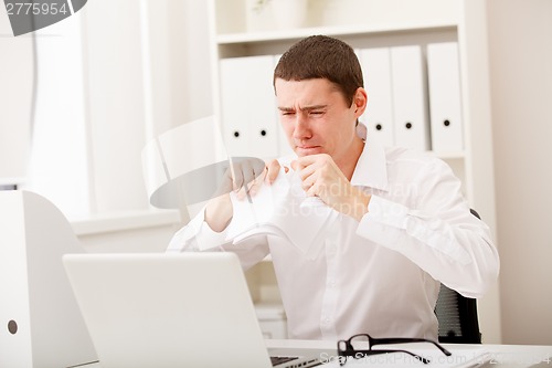Image of angry man with document